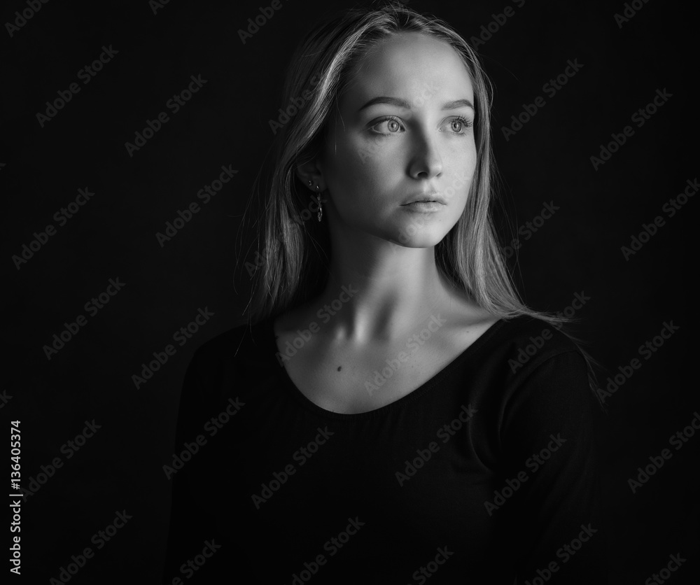 Black and white portrait of a beautiful young woman. Black and white portrait of a beautiful young woman.