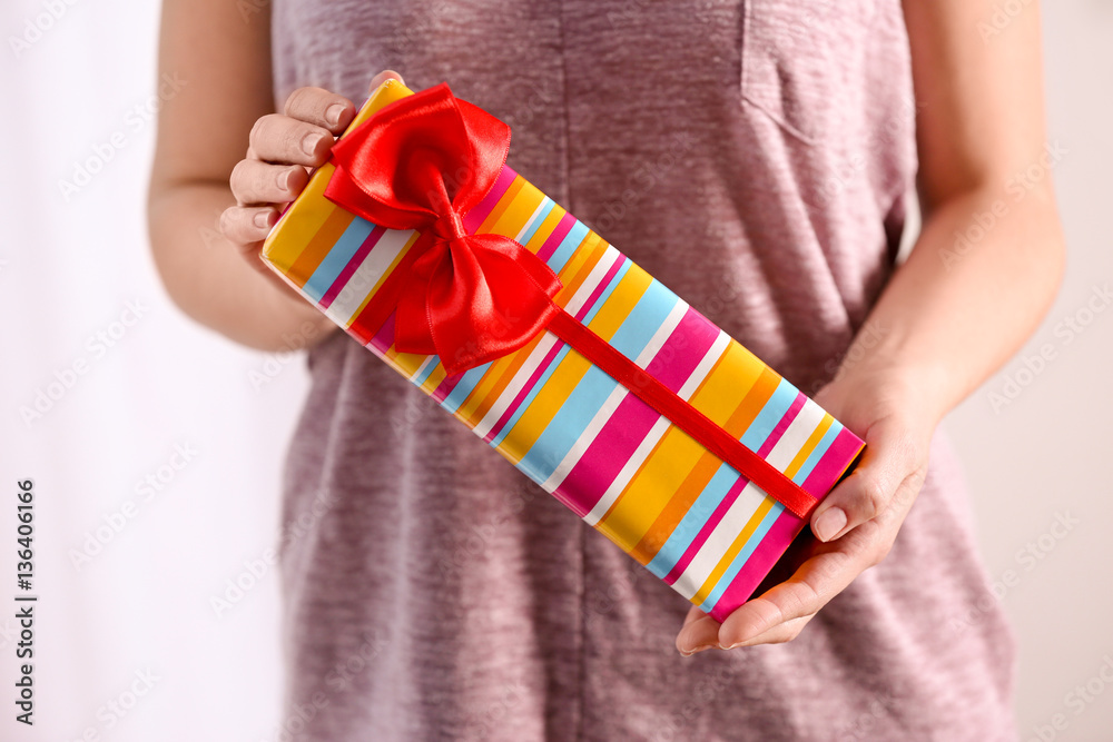 Female hands holding gift box, closeup Female hands holding gift box, closeup