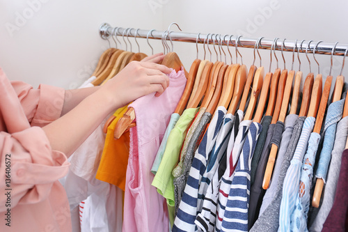 Closeup of woman choosing clothes