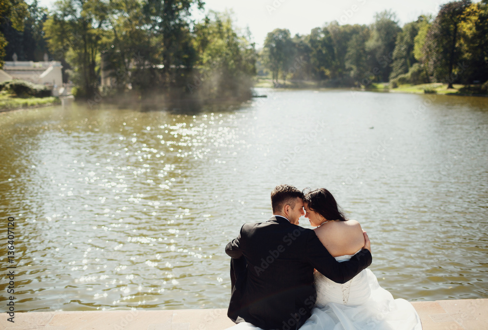 Couple in love next to the lake in the hot weather