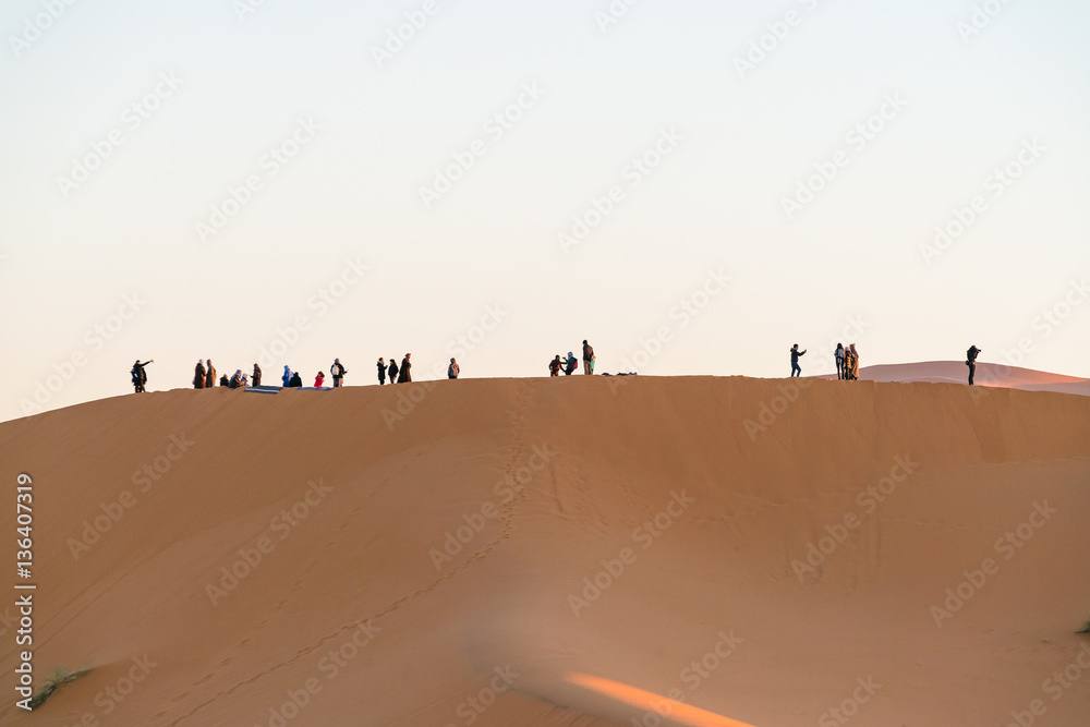 group of tourist observer sand desert
group of tourist observer sand desert