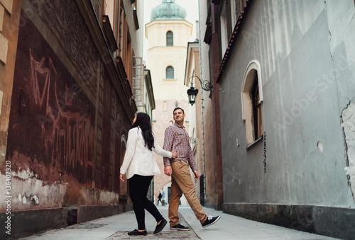 Girl with the boy in the narrow alley © myronovychoksana