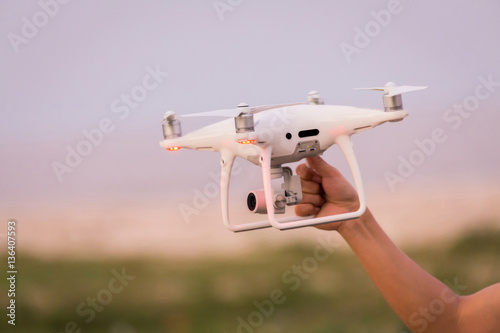 Man holding drone with hand