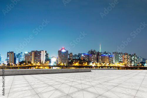 cityscape and skyline of seoul at night from empty floor