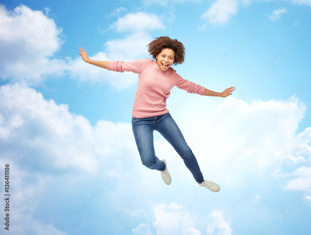 happy african american woman jumping over white happy african american woman jumping over white