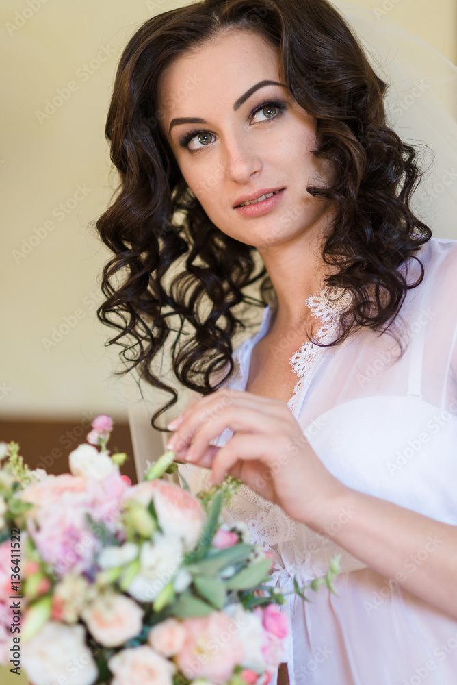 Beautiful young bride in lingerie. Last preparations for the waiting groom Beautiful young bride in lingerie. Last preparations for the waiting groom