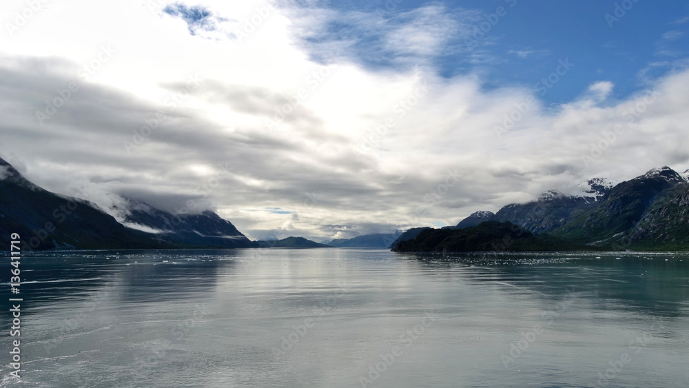 Mountains of Glacier Bay with partly cloudy sky