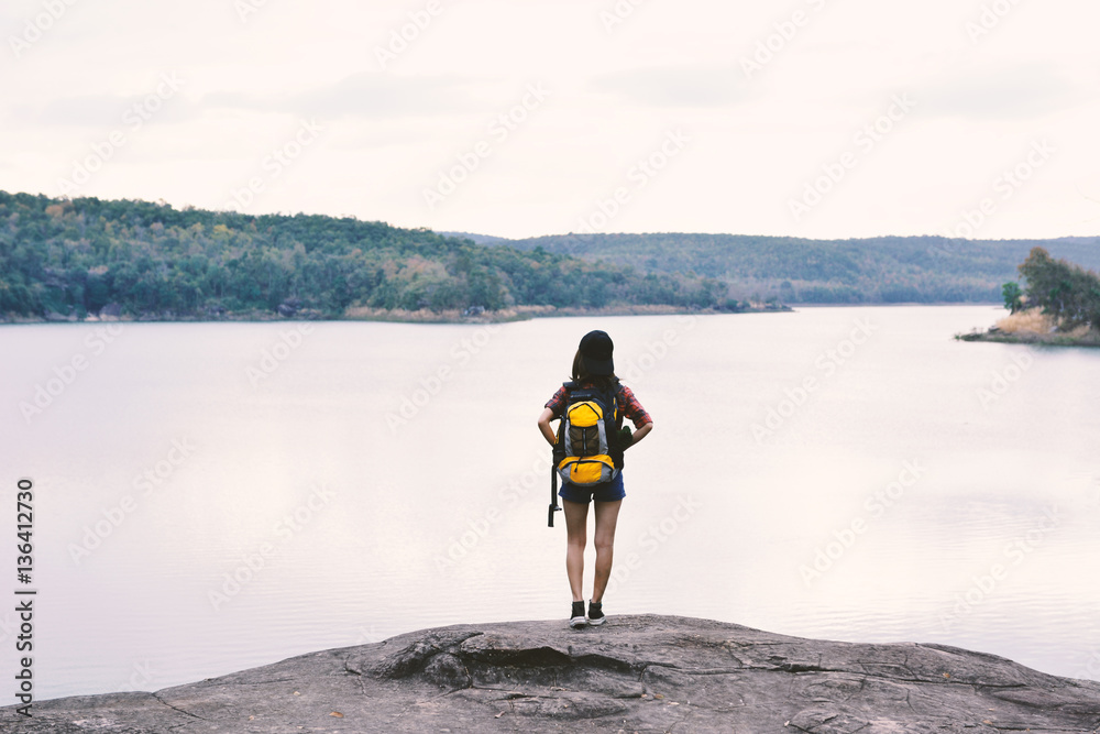 Happy Asian hipster women backpack in nature background