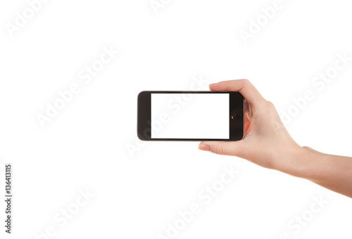 Hand girl holding a mobile phone on a white background
