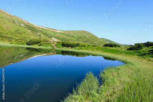 Mountain Lake on a clear summer day in the Carpathian mountains.