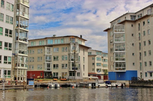 Modern architecture in Karlstad, Sweden: Residential buildings with conservatory for each apartment. On the banks of the river Klaralven, motor boats right on the doorstep.