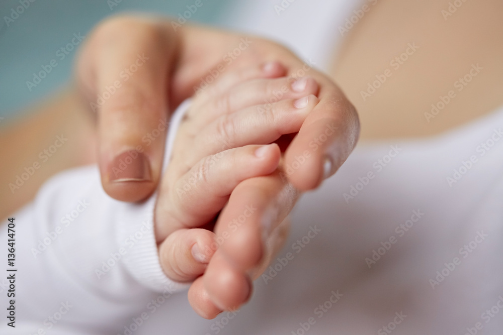 close up of mother and newborn baby hands close up of mother and newborn baby hands