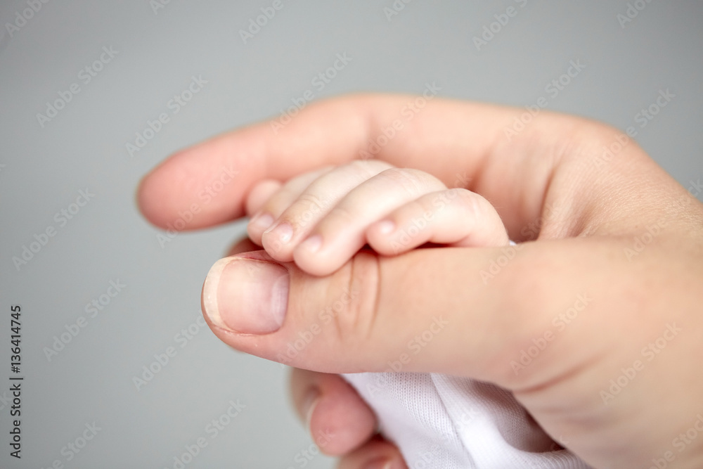 close up of mother and newborn baby hands close up of mother and newborn baby hands