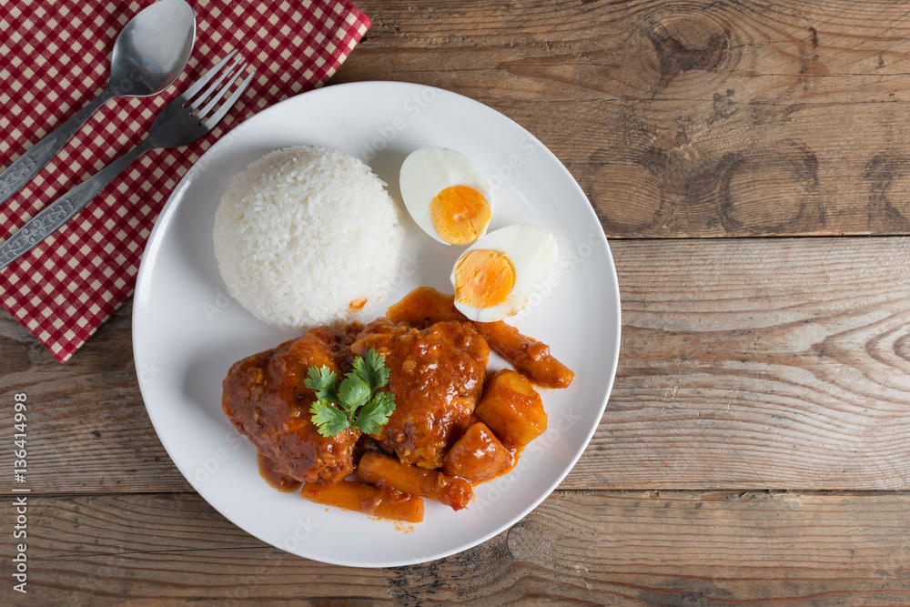 Chicken stew with sauce tomato and egg, rice. Top view. Chicken stew with sauce tomato and egg, rice. Top view.