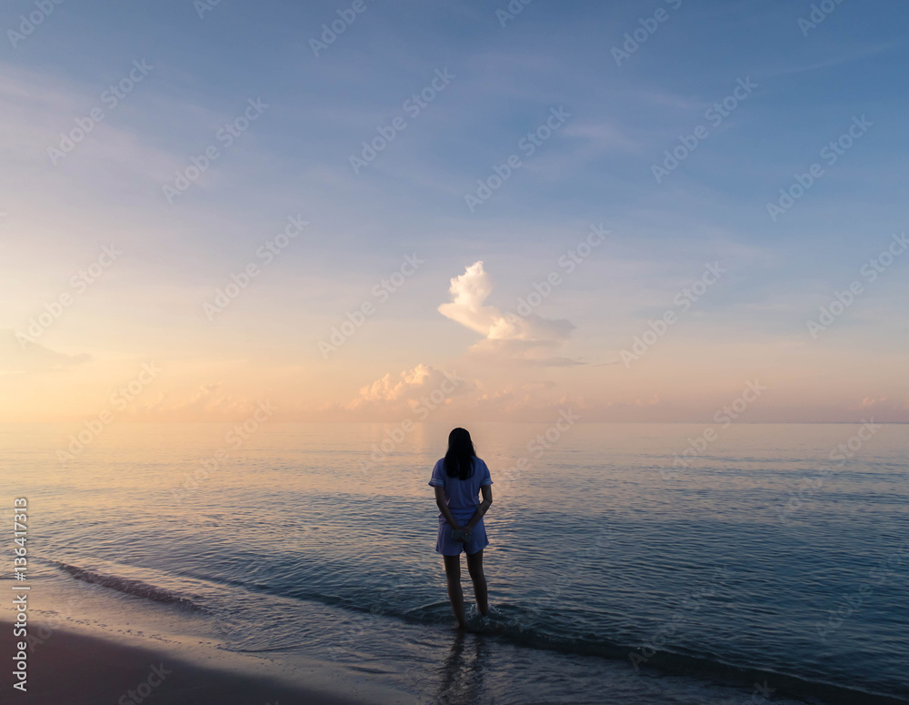 Silhouette of woman walking on the beach background with vintage