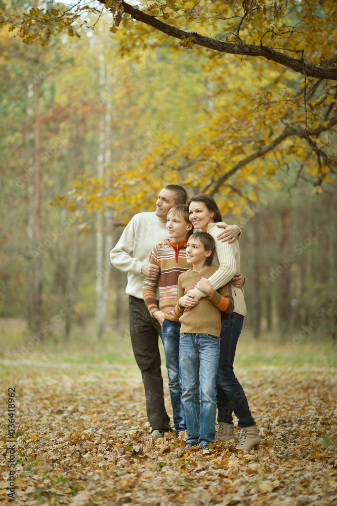 Family of four in autumn Family of four in autumn