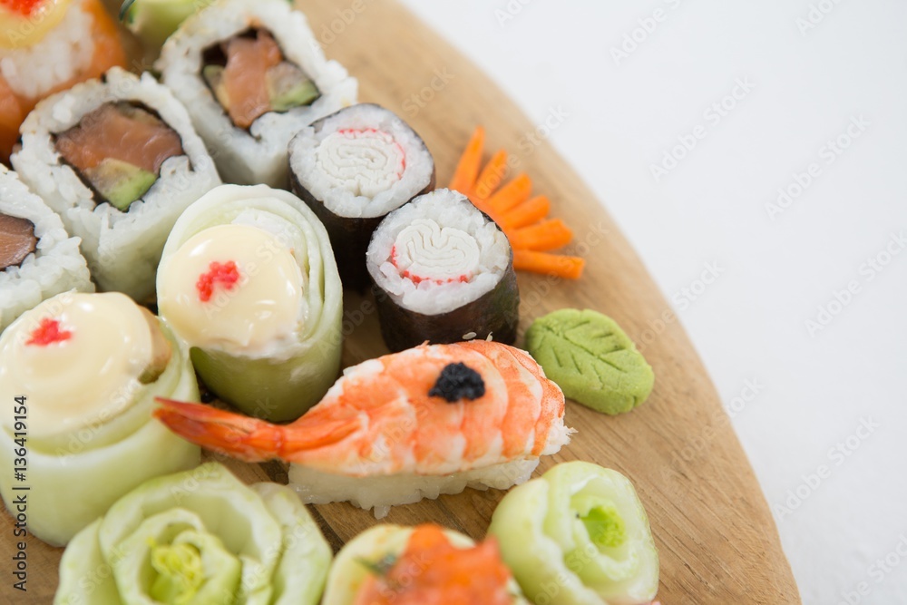 Set of assorted sushi served on wooden tray Set of assorted sushi served on wooden tray