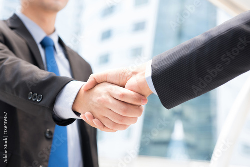 Businessmen making handshake