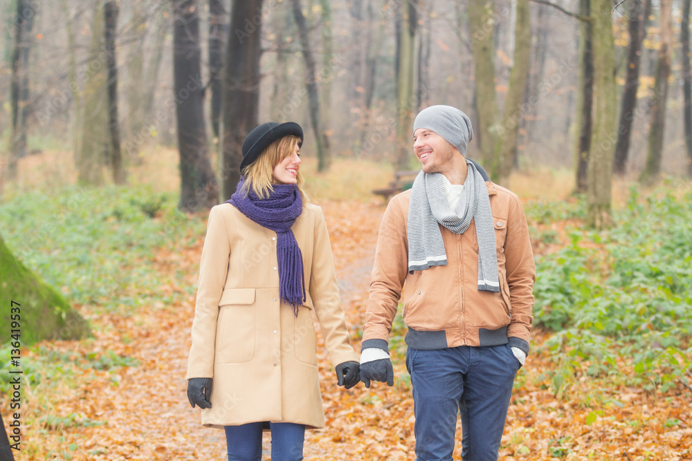 Young couple hanging out in park. Young couple hanging out in park.