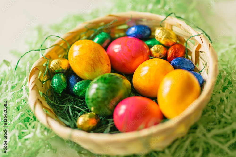 colored eggs in basket colored eggs in basket