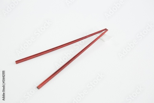 Red chopsticks on a chopstick rest