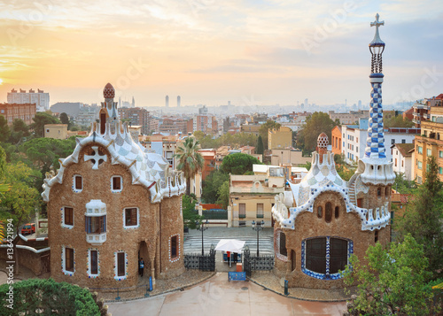 Park Guell in Barcelona. View to entrace houses with greenery on foreground