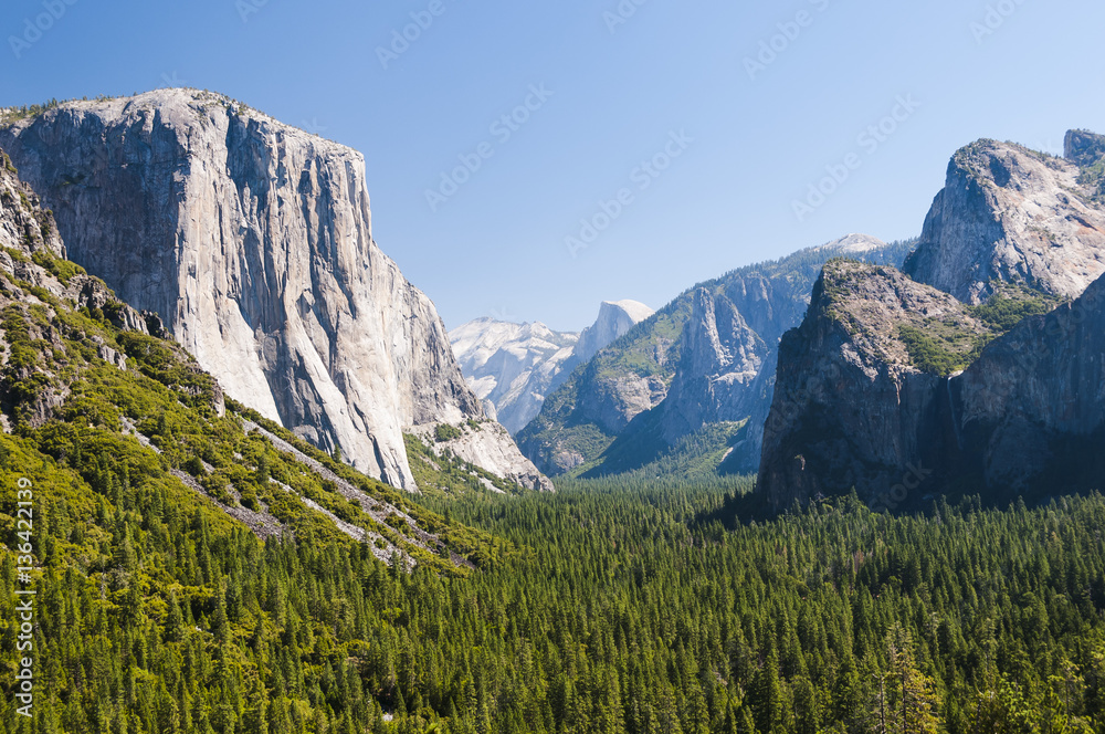 Fototapeta premium View of famous Yosemite Valley with Half-dome in hot summer day.