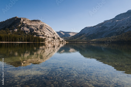 Scenic view of calm lake in afternoon light.