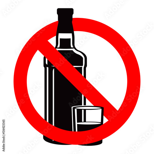 Bottle of alcohol drink and stemware in no allowed sign