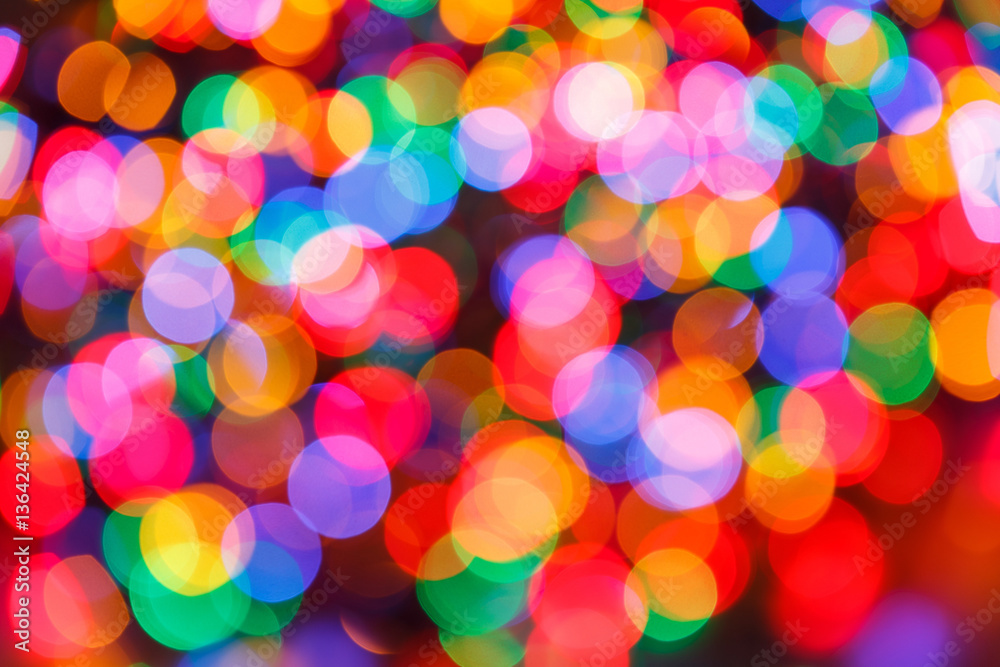 Blurred lights colorful background. Glittering christmas effect. Abstract colorful pattern. Shimmering blur spots. Festive design.