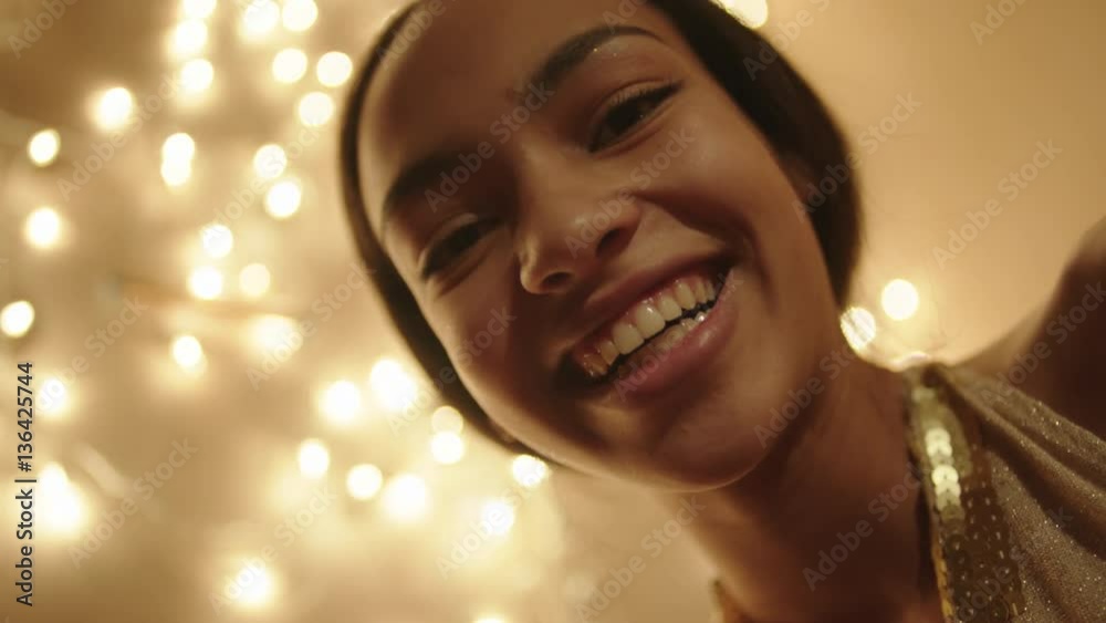 Beautiful woman looking into the gift box and smiling