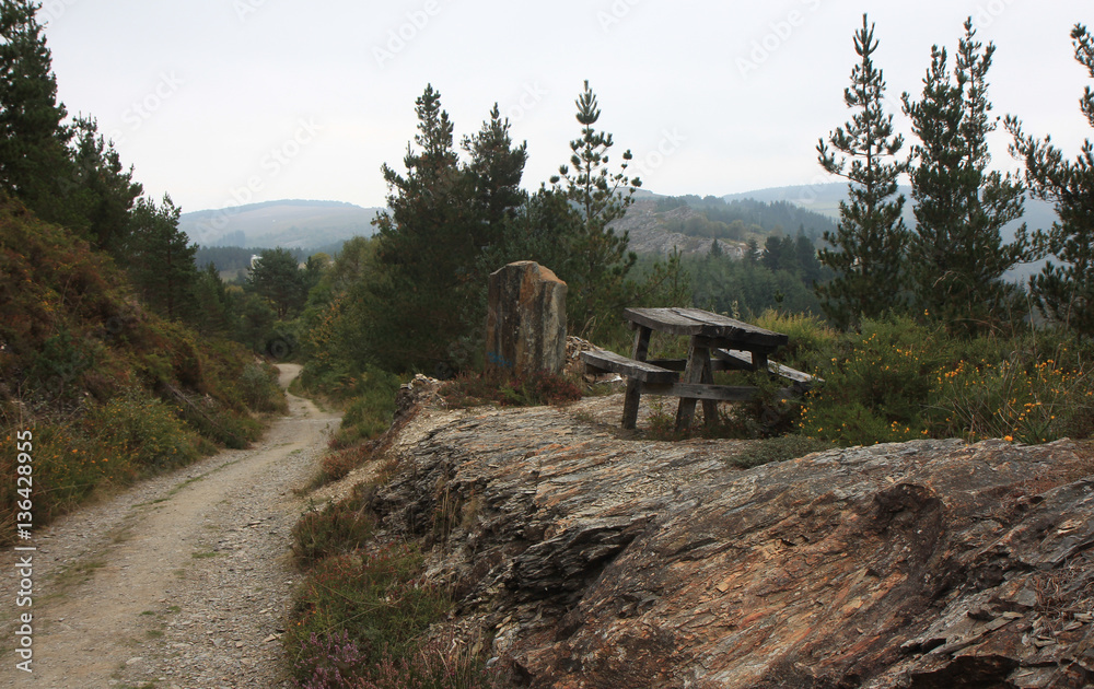 banches and a table near the road in the mountains of Spain,place for leisure travelers banches and a table near the road in the mountains of Spain,place for leisure travelers