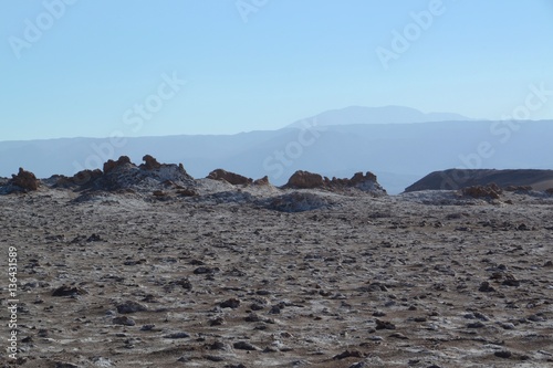Moon like landscape with mountains stretching far into the distance, San Pedro de Atacama Chile.