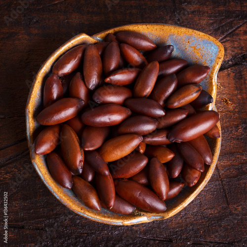 Baru almond on wooden background photo