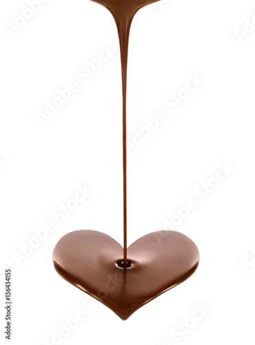 Hot chocolate stream in the form of heart on white background