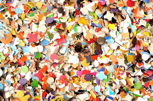 Carnival background, colored confetti, top view