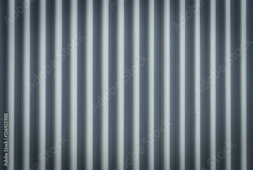 Corrugated metal sheet. Bluish background pattern.