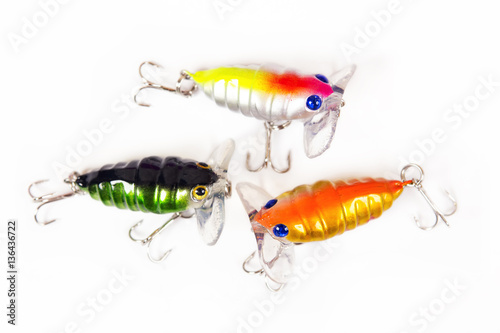 Set of fishing lures isolated on white. Wobblers in three color. Green, yellow and red colors.