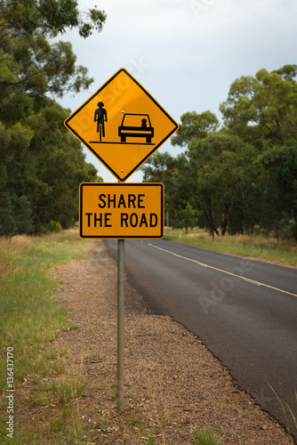 Share the road with cyclists Australian warning road sign