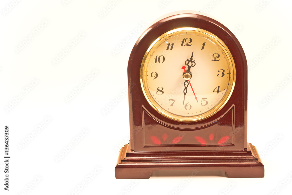 Antique clock in wooden frame isolated on white Antique clock in wooden frame isolated on white