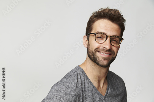 Happy guy in spectacles, portrait photo