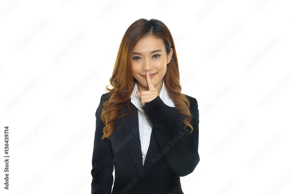Business woman showing silence hand gesture Business woman showing silence hand gesture