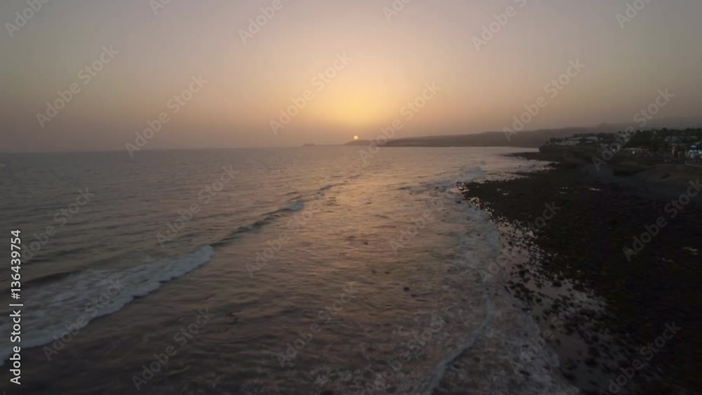 Aerial view of picturesque island landscape in sunset time at the sea, clear sky and night city, Gran Canaria Island, Spain Aerial view of picturesque island landscape in sunset time at the sea, clear sky and night city, Gran Canaria Island, Spain