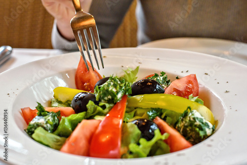 Fresh Greek salad closeup in a restaurant