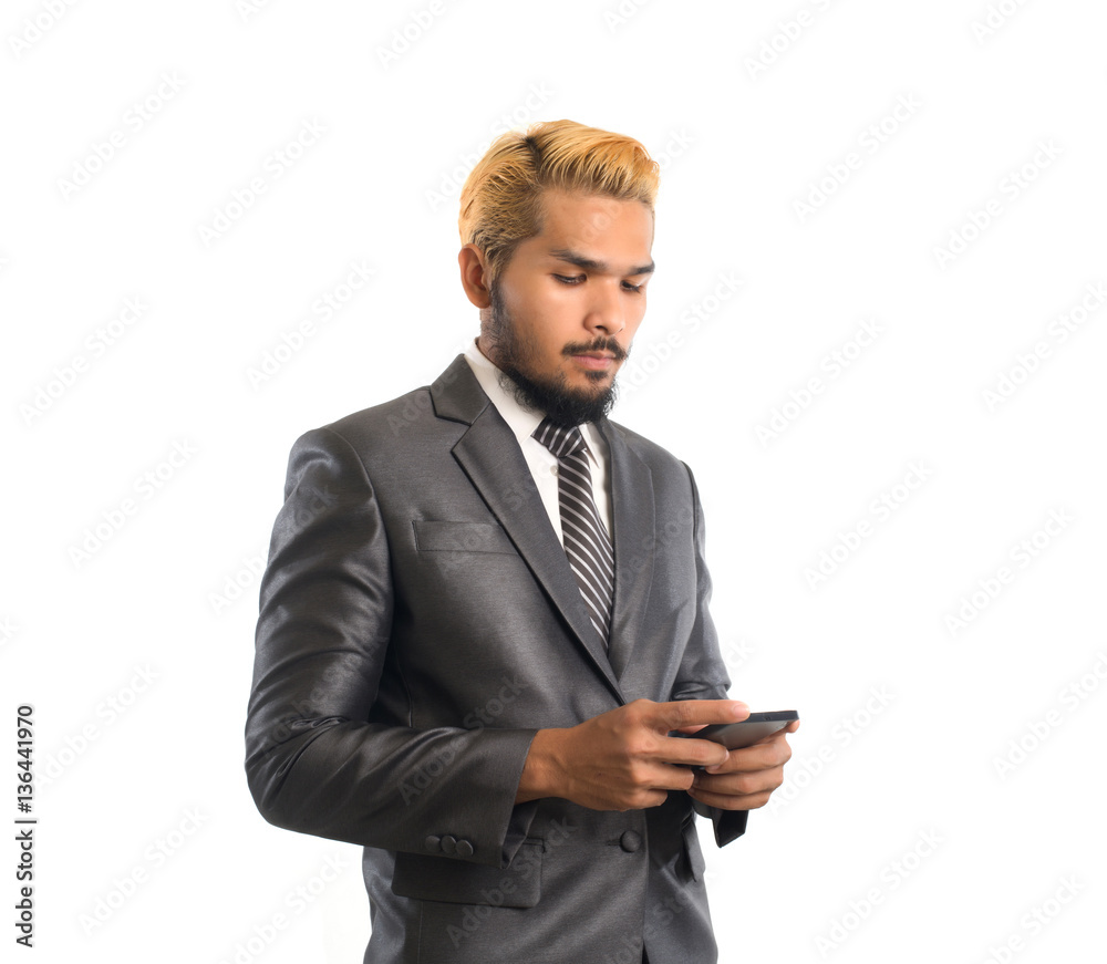 Business confident young man in suit using smartphone. Isolated Business confident young man in suit using smartphone. Isolated
