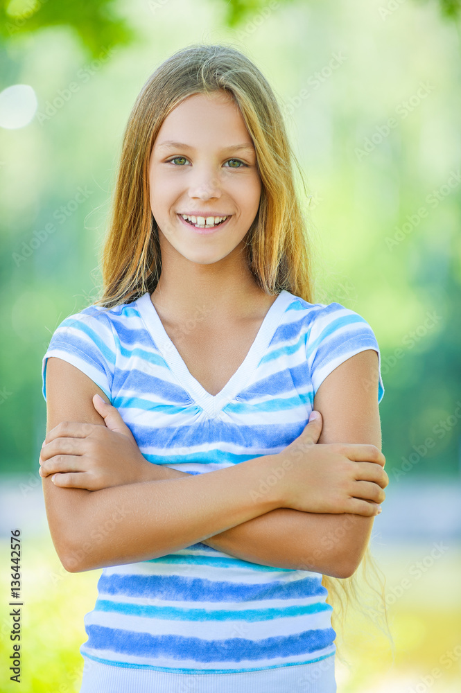 smiling teenage girl in white blouse Photos | Adobe Stock