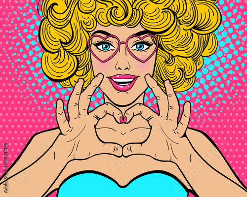 Wow pop art face. Sexy young woman with open smile and blonde curly hairstyle in glasses in form of heart shows love sign by her hands. Vector colorful invitation poster in pop art retro comic style.