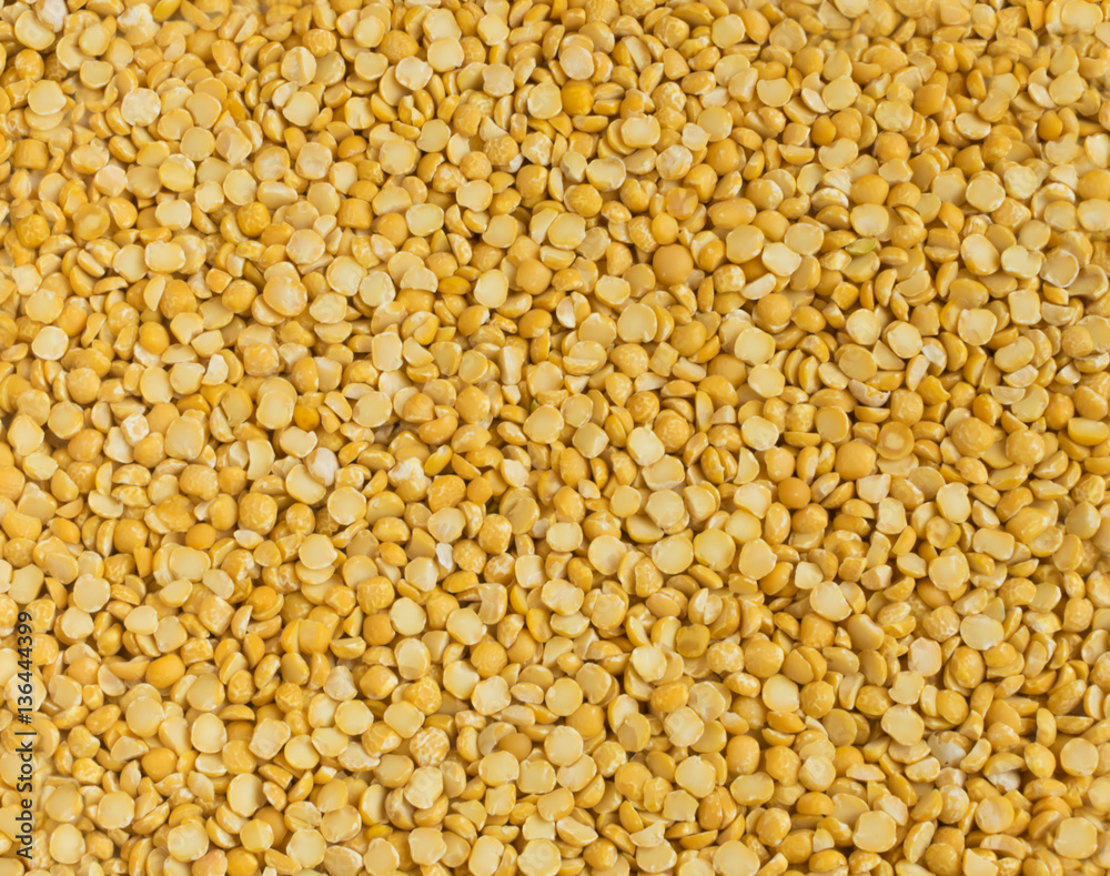 Dry Split Yellow Peas Scattered on Old Wooden Cutting Board Dry Split Yellow Peas Scattered on Old Wooden Cutting Board