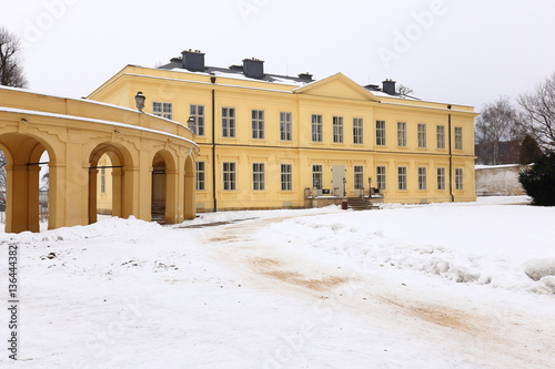 Large yellow renovated building of Ploskovice castle