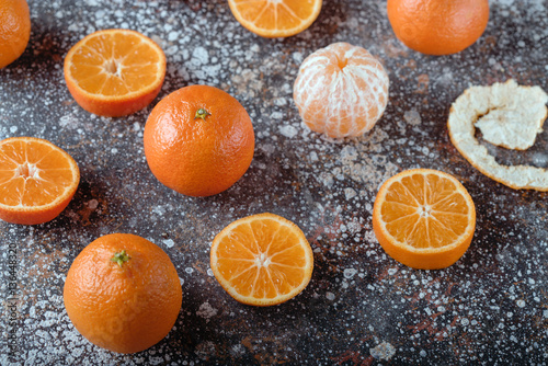 Juicy orange tangerines on a dark background